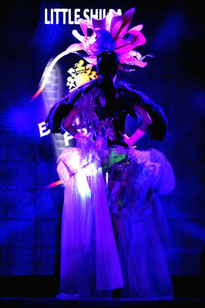 Model in Venetian masks and couture outfits at Blenders Pride Fashion Tour event